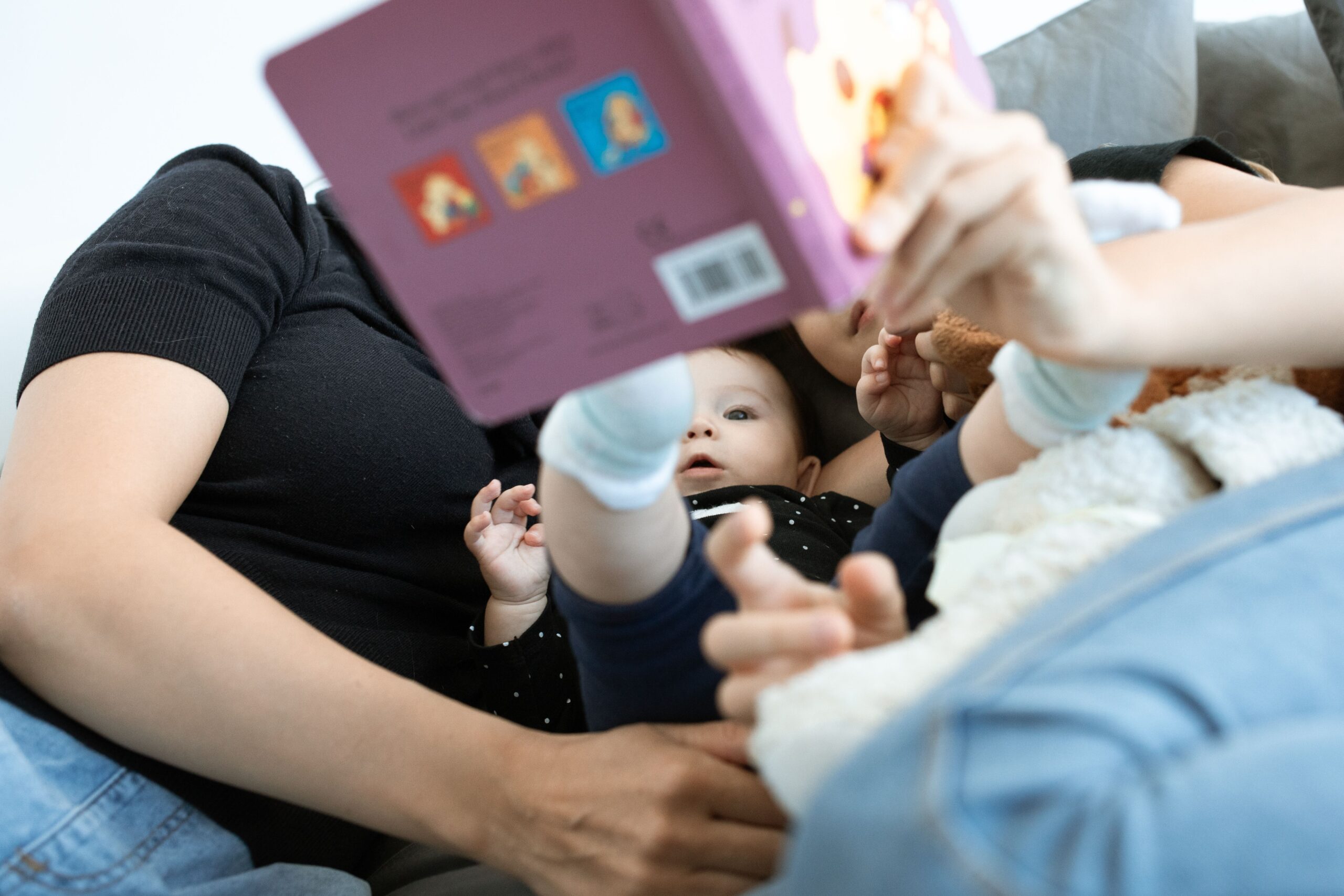 Best board books for babies: a family reading together for bedtime bonding