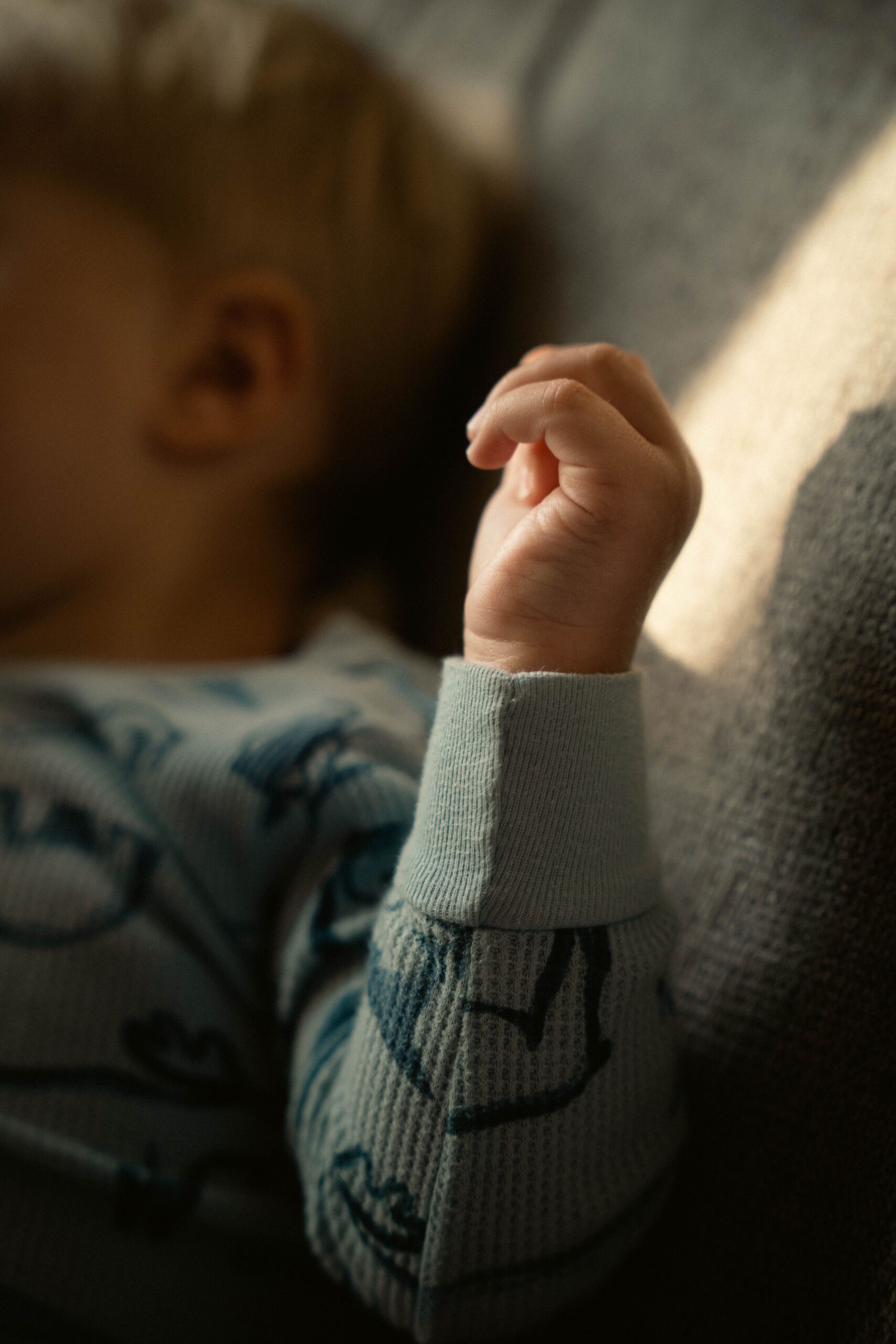 Toddler sleeping in soft pajamas, bamboo vs cotton pajamas comparison